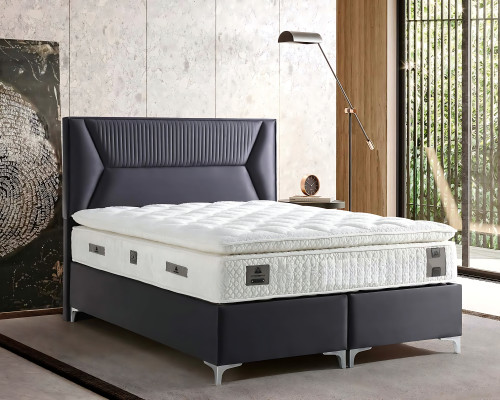 Elegante grijze bed met stoffen en houten matras
