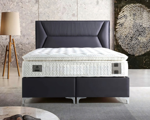Elegante grijze bed met stoffen en houten matras