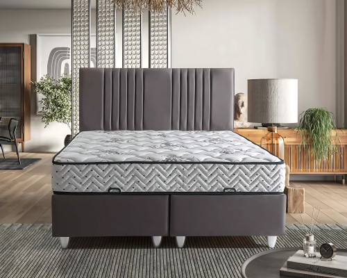 Grijze stoffen bed met moderne matras