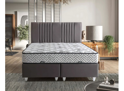 Grijze stoffen bed met moderne matras