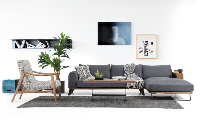 Woonkamer hoekbank L-vorm bankstel stof grijs modern design.