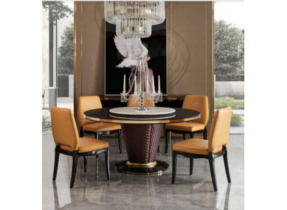 Luxe design eetkamer met ronde tafel en 6 metalen leunstoelen.