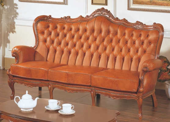 Luxe 3-zitsbank van bruin leer in art-decostijl.