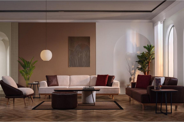 Stijlvolle bruin-witte bankstel woonkamer fauteuil salontafel poef