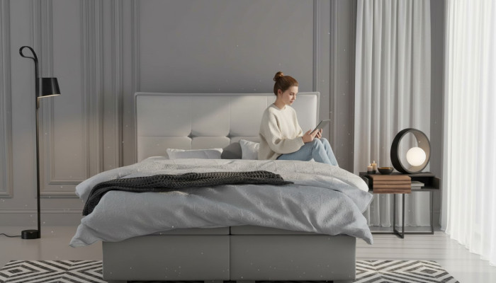 Boxspring bed hotel dubbel textiel grijs luxe bedden gestoffeerde bedlade functie.