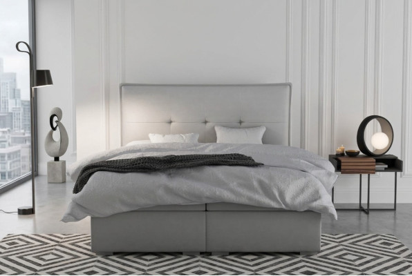 Boxspring bed hotel dubbel textiel grijs luxe bedden gestoffeerde bedlade functie.