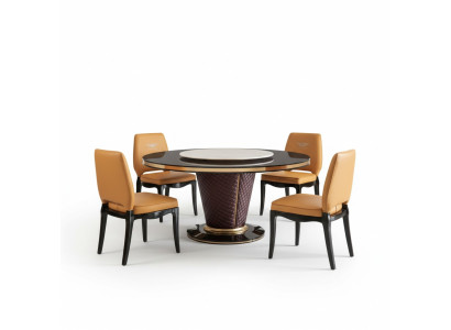 Luxe design eetkamer met ronde tafel en 6 metalen leunstoelen.