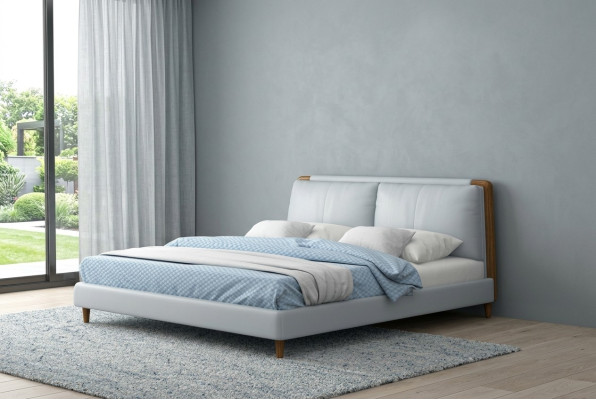 Moderne tweepersoonsbed van 180x200 in wit lederen design op houten poten.