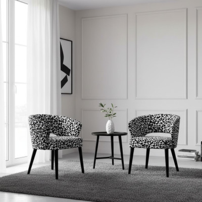 Oorspronkelijke zwarte en witte houten en stoffen stoel voor de woonkamer.