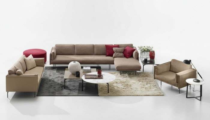 Bruine hoekbank L-vorm bank design gestoffeerd modern textiel woonkamer