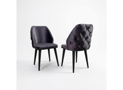 Gevoerde houten stoel grijs Chesterfield op zwarte poten voor eetkamer.