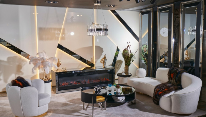 Luxe witte woonkamerset met 3-zits bank, fauteuil en ronde salontafel.