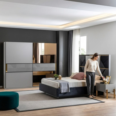 Perfecte slaapkamermeubelset in grijstinten met gouden inlegwerk.