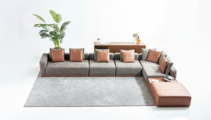 Grijze woonkamer zithoek hoekbank designstoffen bankstel