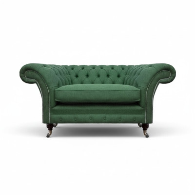 Elegante Chesterfield groene fauteuil woonkamer textiel edele eenzits.
