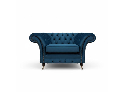 Blauwe woonkamer Chesterfield stoffen fauteuil luxe eenzitter stoffen meubel.