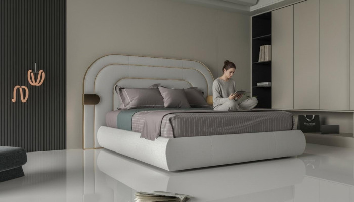 Luxe grijze bedframe met gouden details in modern ontwerp en zachte hoofdeinde